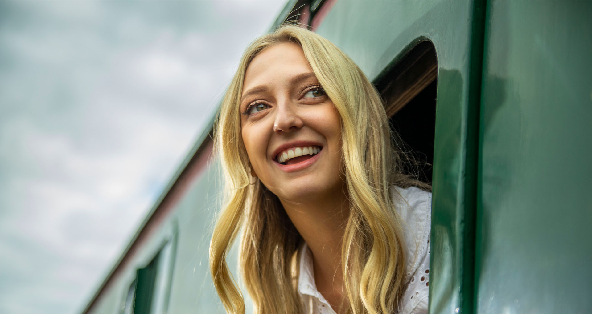 A still from a BH Movie featuring a woman on a train.