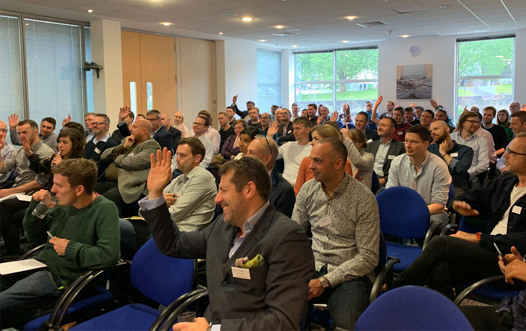 Large group of business people attending business conference