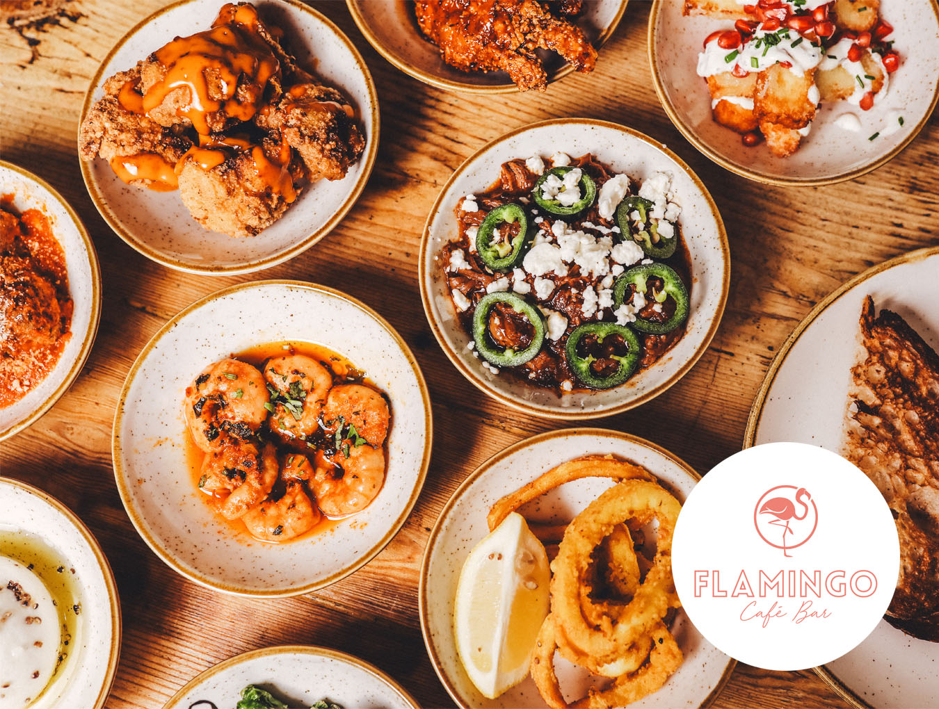 multiple plates of food displayed on table