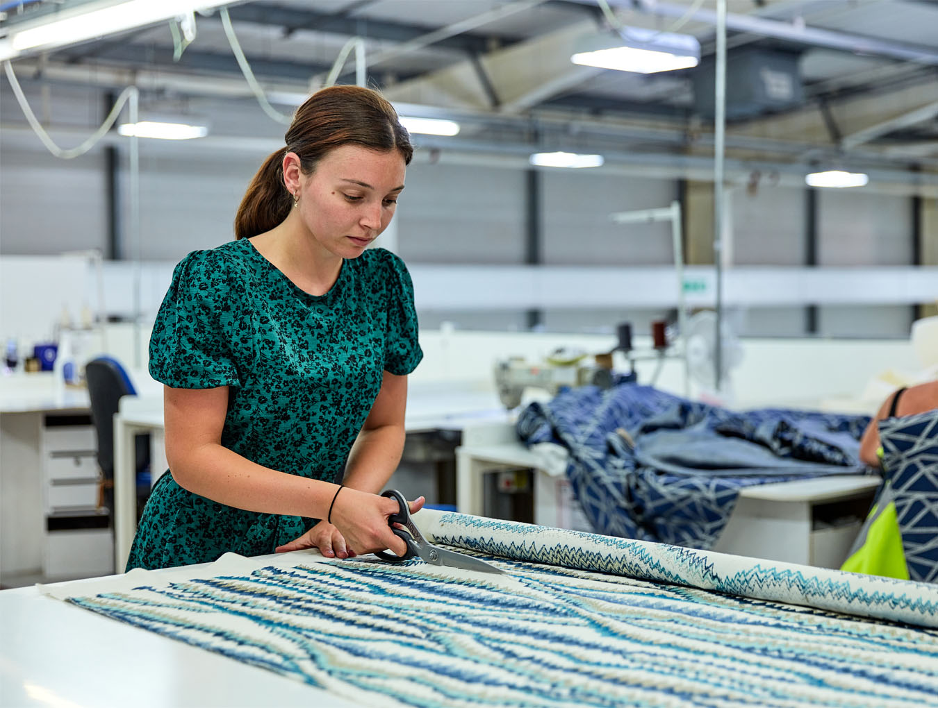 Woman cutting fabric
