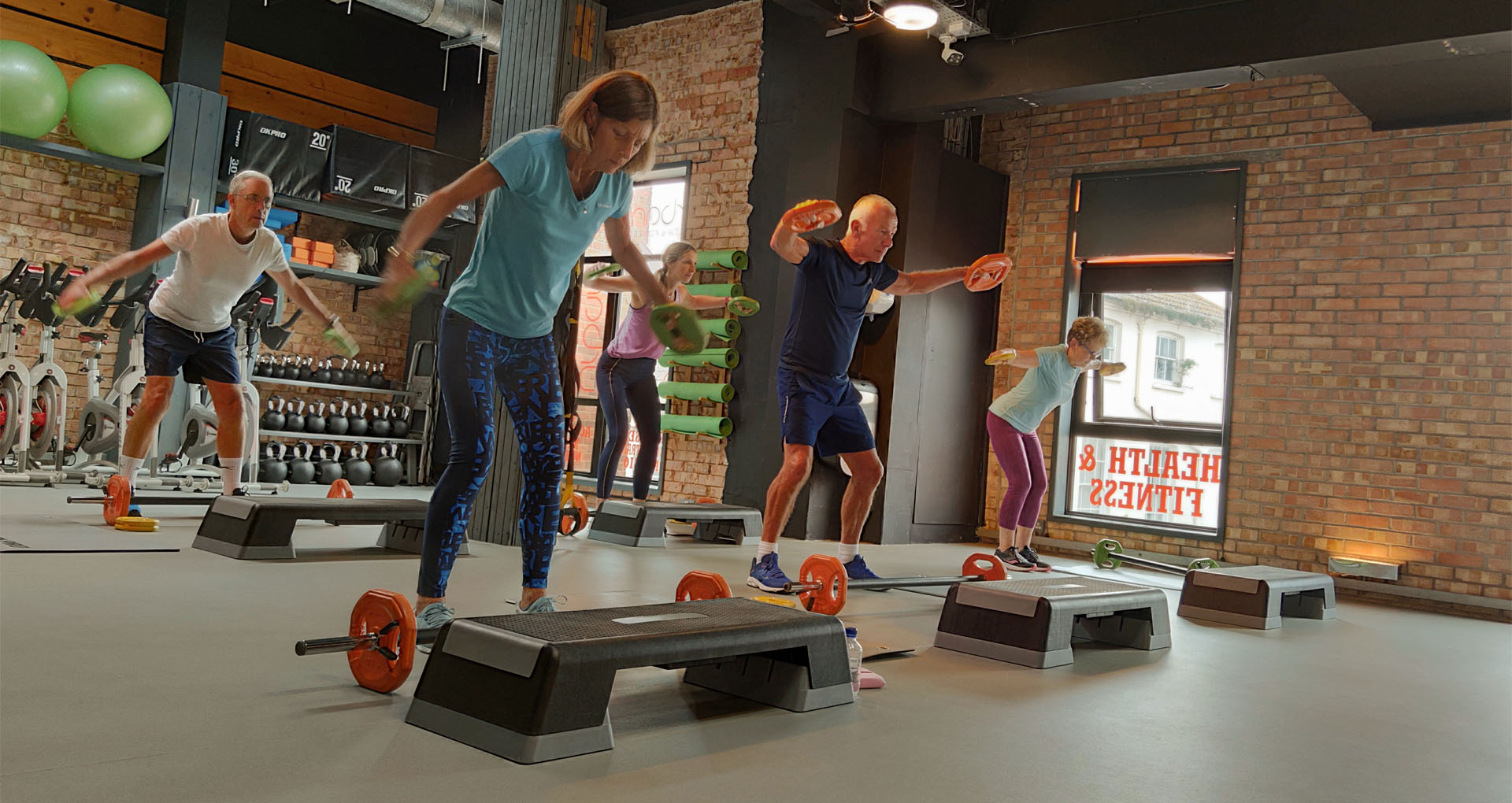 Group of people exercising with weights